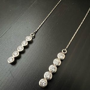 925 sterling silver and cubic zirconia dangle earrings.